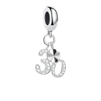 Silver charm with number 30 and clover.