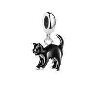 Black cat charm with shiny black enamel, featuring a playful design, by Planet Charms. Perfect for Halloween and costume par