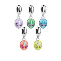 Colorful alien charm pendants.