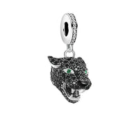 Black panther charm with green eyes.
