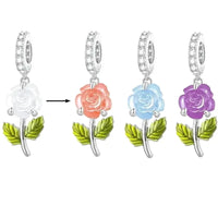 Changing color rose charm in pink, blue, and purple with silver detail and green leaves by Planet Charms.