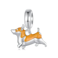 Silver and orange corgi charm.