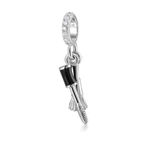 Silver clarinet charm.