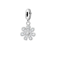 Silver flower charm with embedded crystals.
