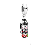 Silver and enamel geisha charm.