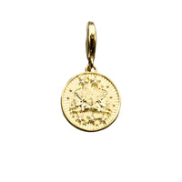 Gold coin pendant with gem accents.