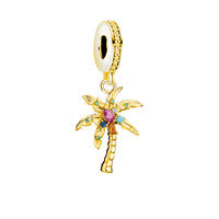 Gold palm tree charm with colorful gemstones.