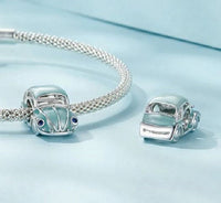 Sterling silver blue car charm by Planet Charms, featuring intricate detailing and vibrant enamel accents.