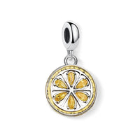 Silver and yellow lemon slice charm.