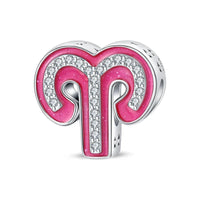 Pink and silver Aries zodiac charm.