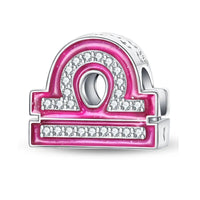 Pink and silver Libra charm.