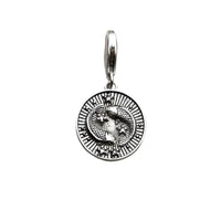 Silver pendant with intertwined snakes.