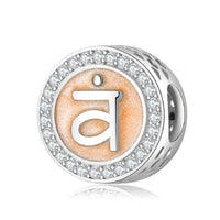 Silver chakra bead with rhinestones.