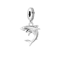Silver shark charm.