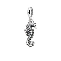 Silver seahorse charm.