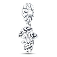 Silver charm with roses and a heart-shaped band.