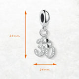 Silver charm with ’30’’ and clover design.