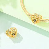Gold Honeycomb Bee Heart Charm styled on a charm bracelet, fits Pandora bracelets