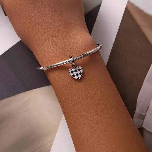 cherecked heart on bracelet