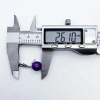 Purple pearl pendant being measured.