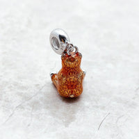 Brown bear charm.