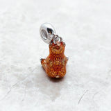 Brown bear charm.