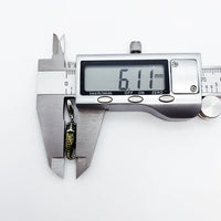 Digital caliper measuring a seahorse pendant.