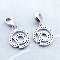 Silver ’@’ symbol charms.