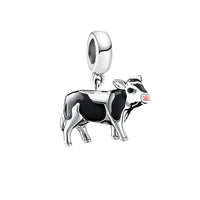 Cow charm with pink nose.