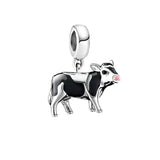Cow charm with pink nose.