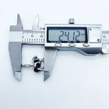 Silver koala ring being measured.