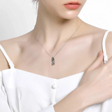 Silver necklace with pendant.