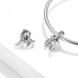 Silver cowboy boot charms.