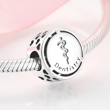 Silver dentistry charm.