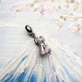 Pink dress charm.