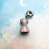 Pink dress charm.