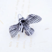 Silver eagle pendant.