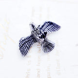 Silver eagle pendant.