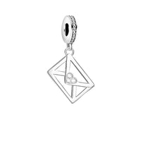 Silver letter charm with heart detail.