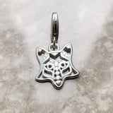Silver fox head charm.