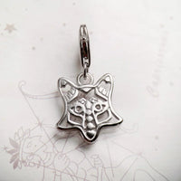 Silver fox charm.