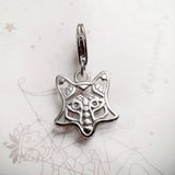 Silver fox charm.