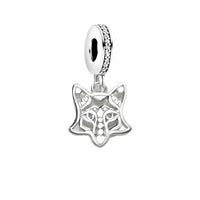 Silver fox charm with jeweled bail.
