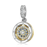 Circular pendant with concentric rings of gems.