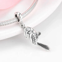Silver parrot charm on a bracelet.