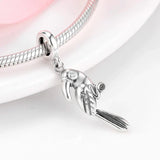 Silver parrot charm on a bracelet.