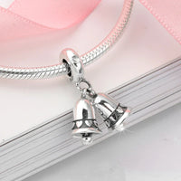 Silver charm bracelet with bell pendants.