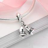 Silver charm bracelet with bell pendants.