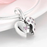 Silver heart charm with pink accents.