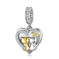 Silver heart charm with cat couple.